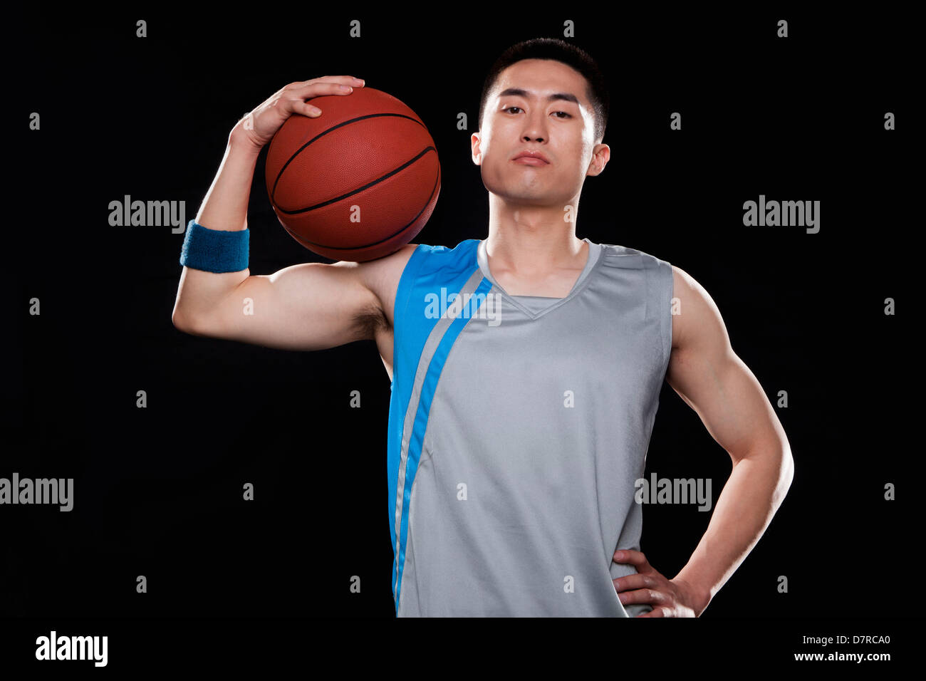 Portrait of basketball player, black background Stock Photo - Alamy
