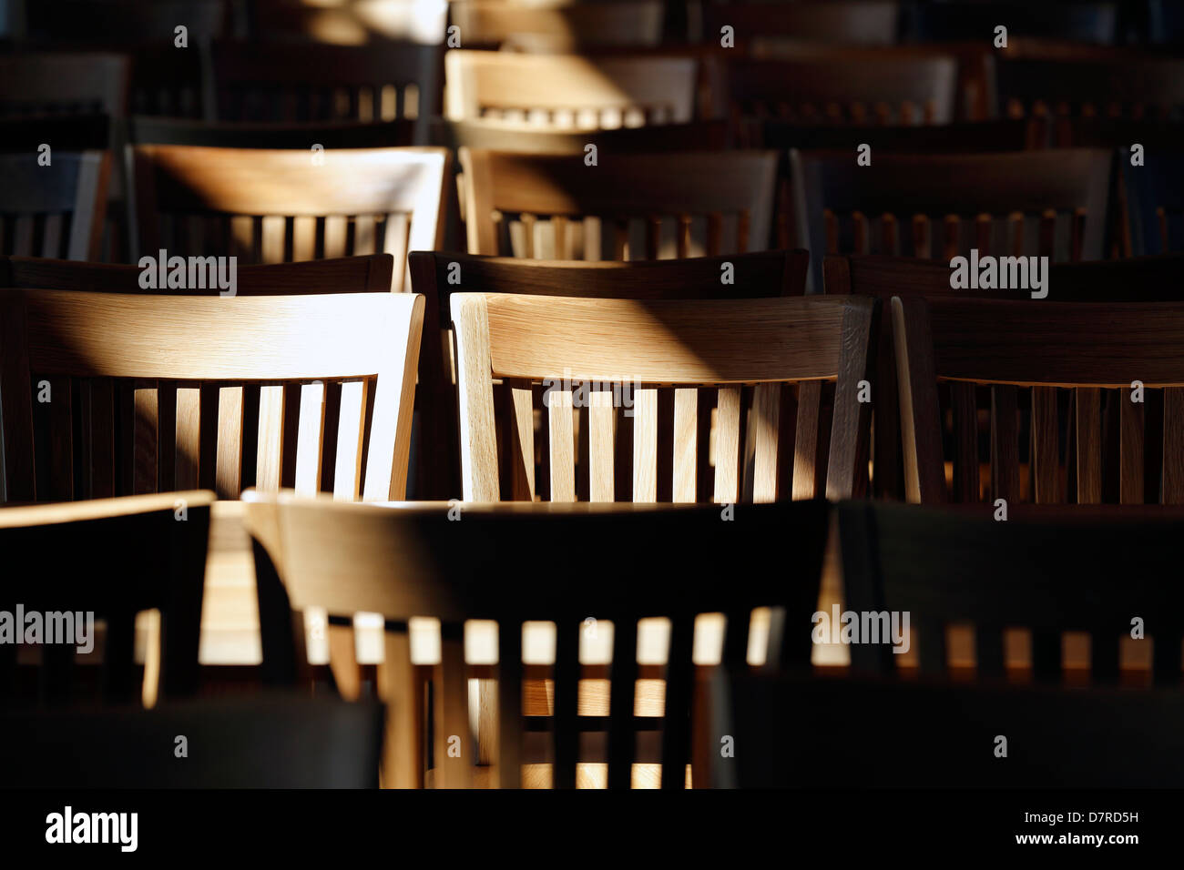 wooden dining hall chairs Stock Photo