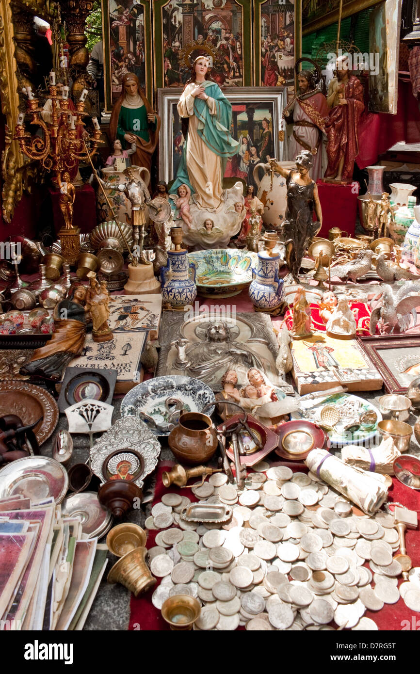Religious attributes and other things for sale on the famous flea market El Rastro in Madrid Stock Photo