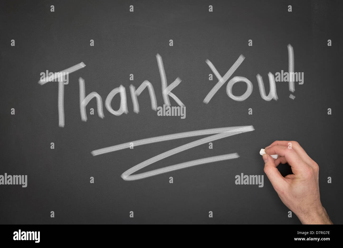 Blackboard with 'Thank You' wrote on it with a hand. Stock Photo