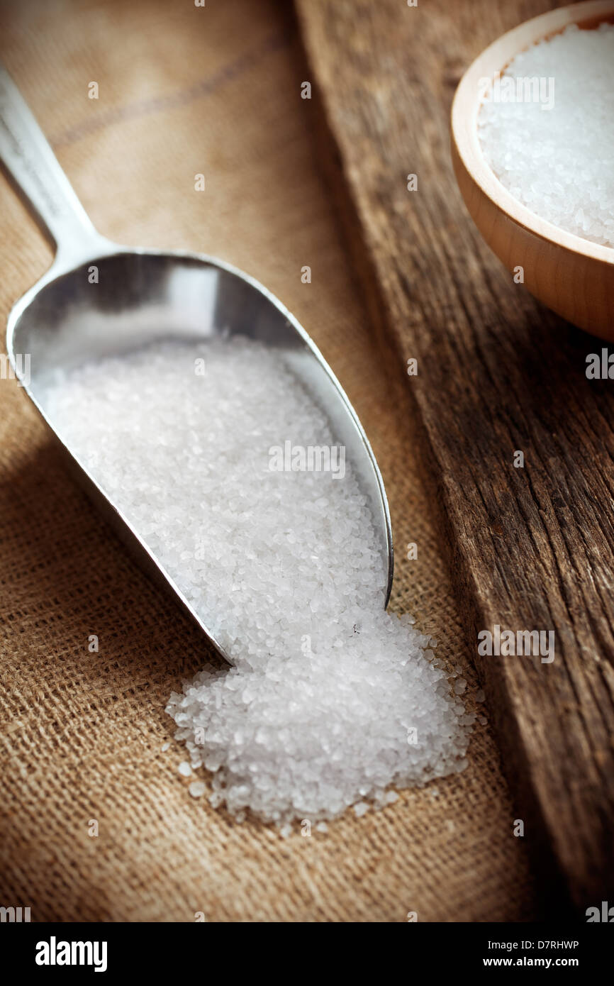 white salt in metal scoop Stock Photo