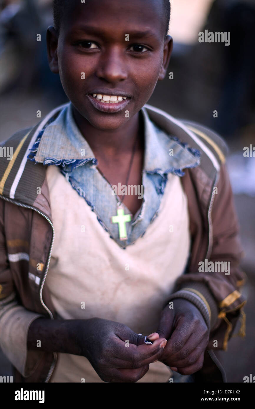 A street boy with a crucifix in Addis Ababa, Ethiopia. Stock Photo
