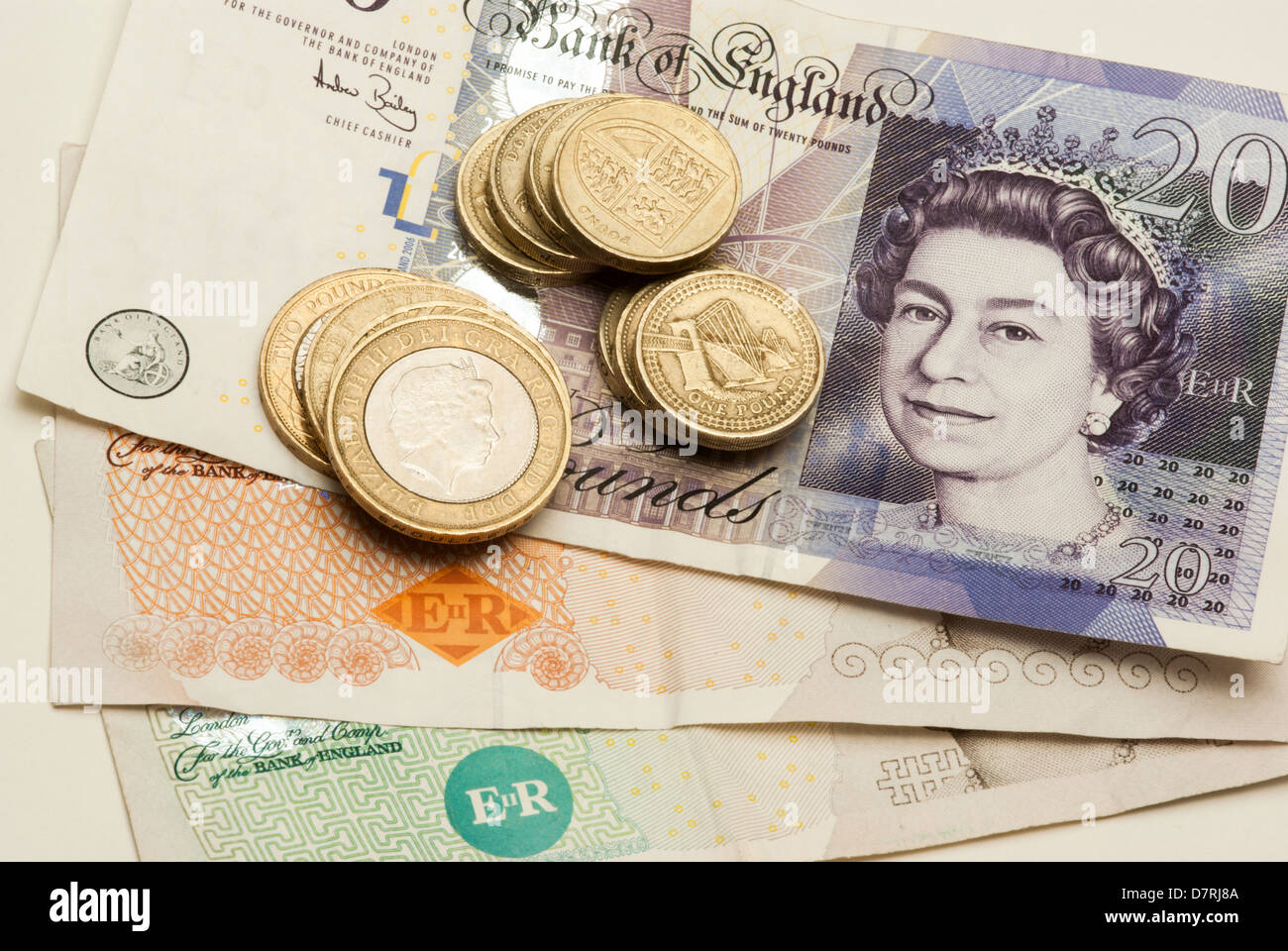 Piles of UK money coins and notes for counting in preparation for saving or payments. Represents thrift and austerity Stock Photo