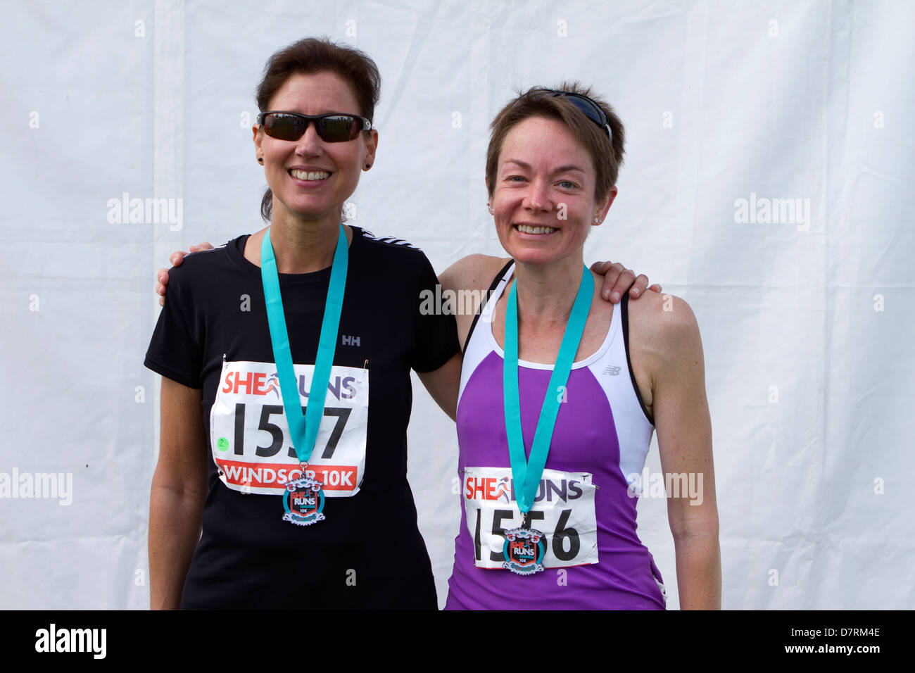 Finishers of the She Runs Windsor event with their medals. Stock Photo