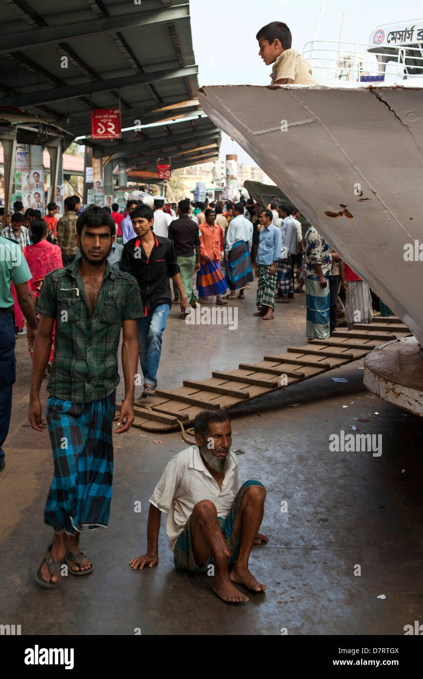 Passengers wait on a ferry at the Sadarghat Ferry Terminal, Dhaka, Bangladesh Stock Photo