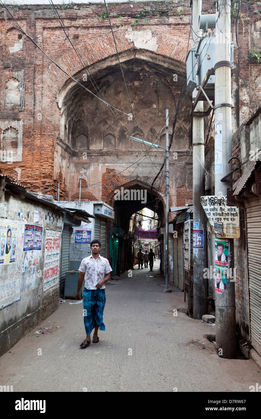 A man walks beneath the Bara Katra, built in 1644, it is the oldest building in Dhaka, Bangladesh Stock Photo