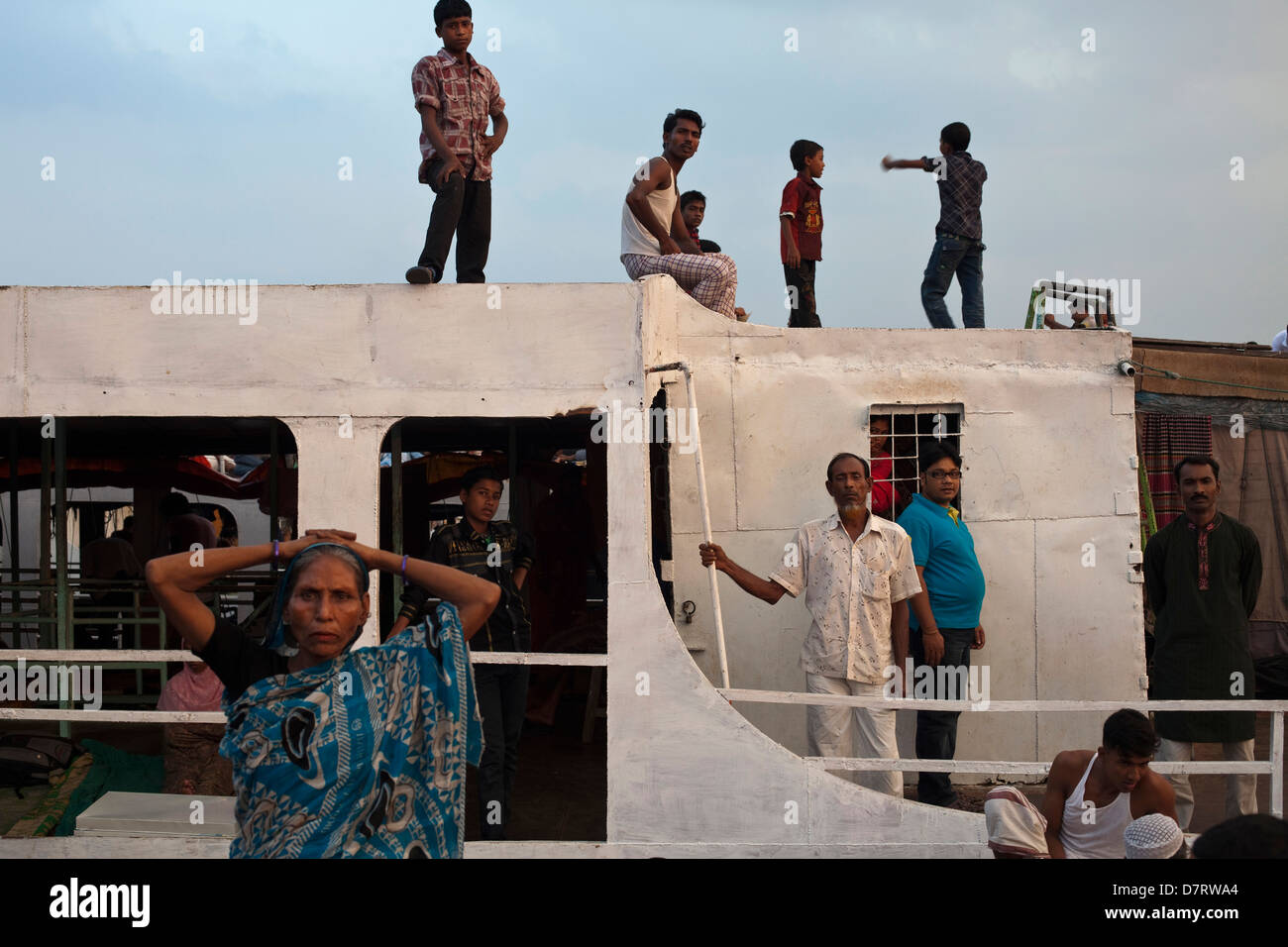 Passengers on a ferry on the Buriganga river at Sadarghat, Dhaka, Bangladesh Stock Photo