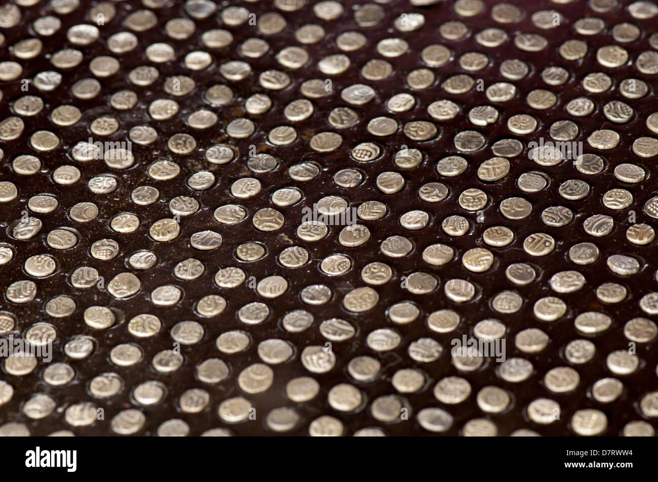 Rasi palaka, the coin board - a wooden board with small niches used to count small coins, coin mints Stock Photo