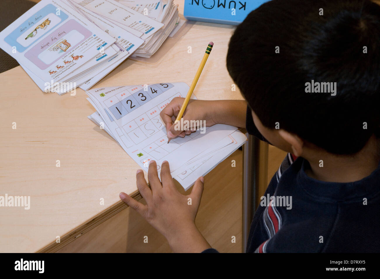 young student completes maths exercise Stock Photo