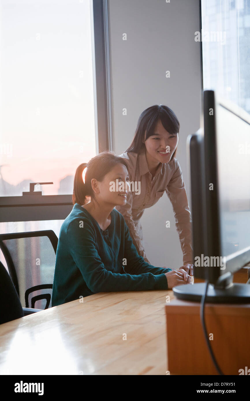 Two Businesswomen Working Together in the Office Stock Photo - Alamy