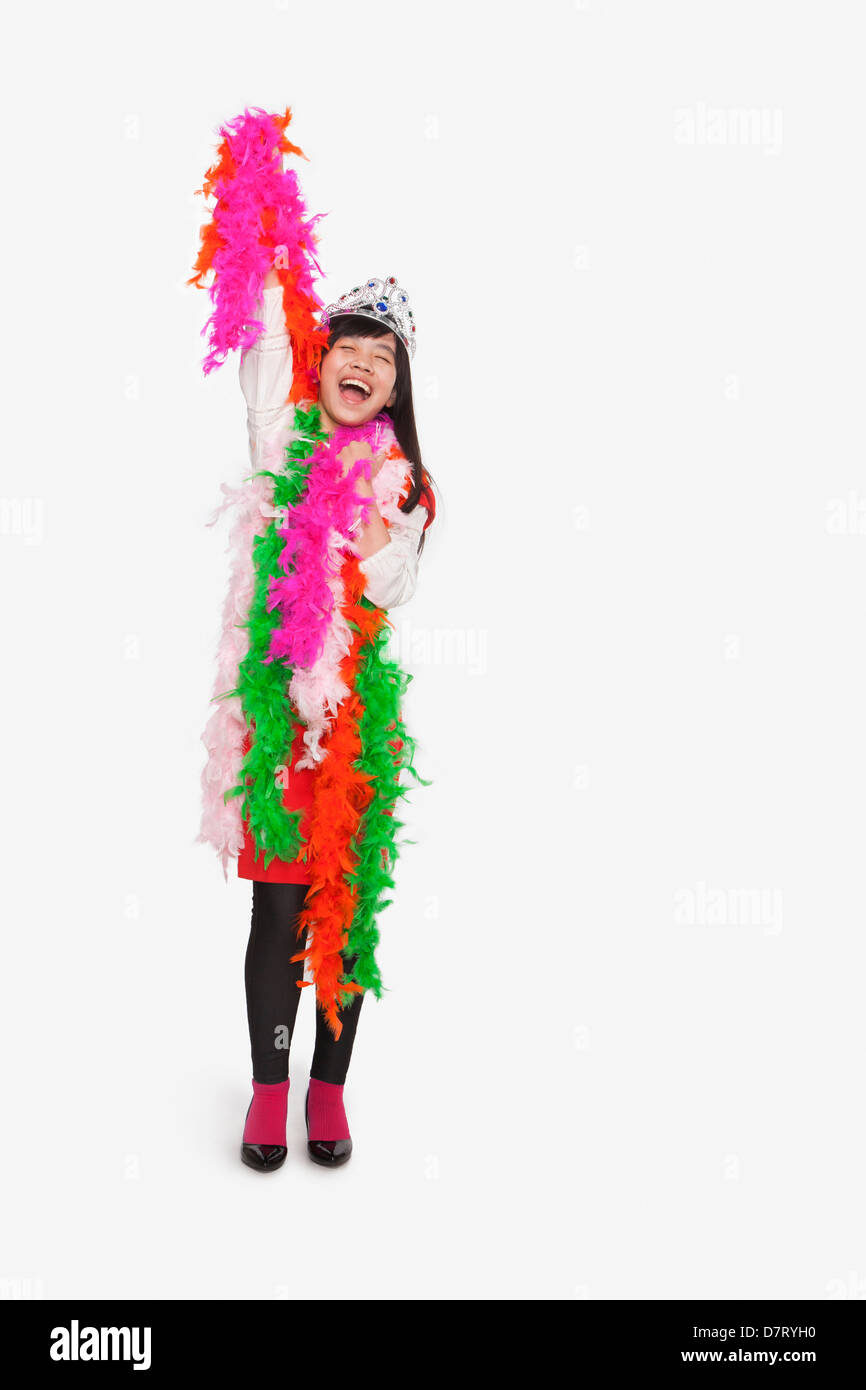 Girl wearing feather boas and tiara Stock Photo Alamy