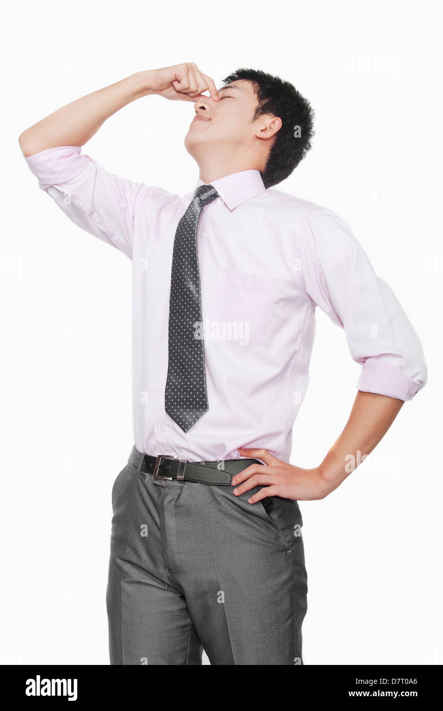 Young man with eyes closed thinking Stock Photo