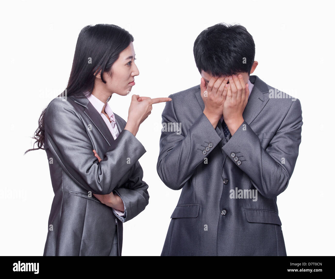 Businesswoman scolding businessman Stock Photo