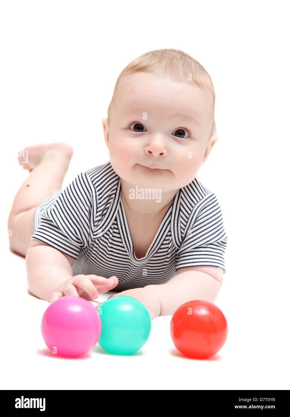 Happy baby with balls Stock Photo