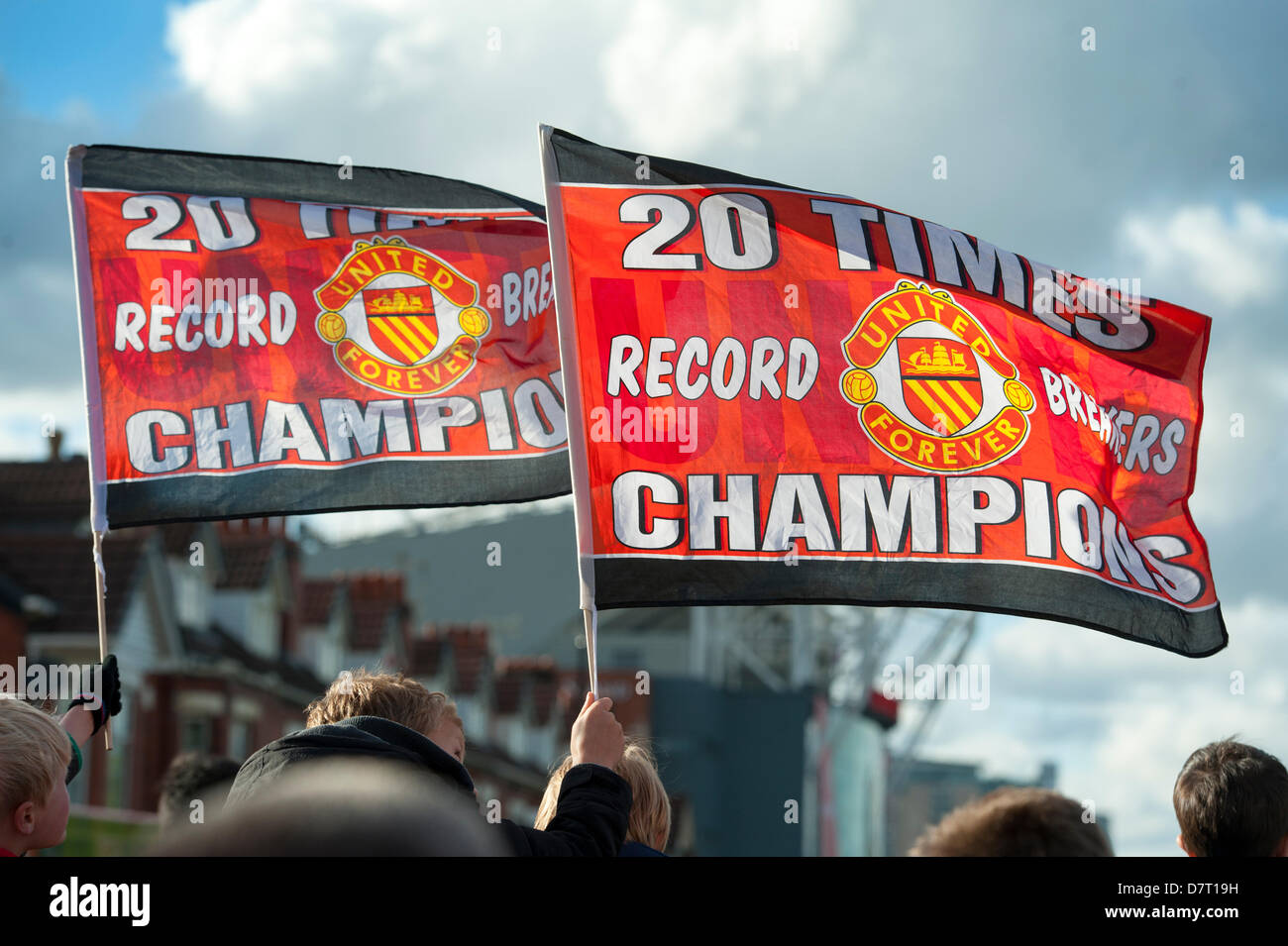 Manchester, UK. 13th May, 2013. flags held aloft outside old trafford football ground during the victory parade. Credit: Lee Avison/Alamy Live News Stock Photo
