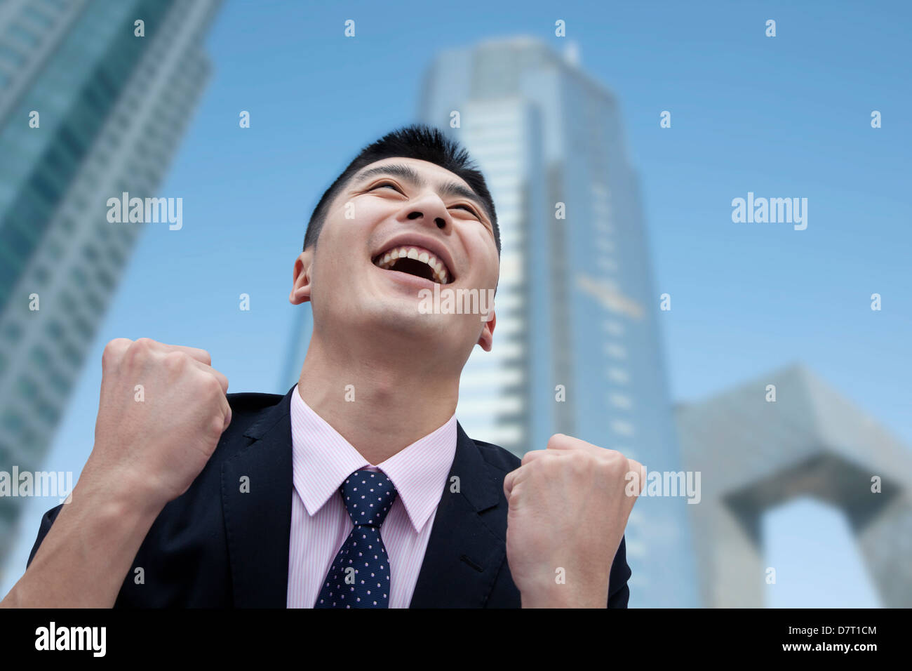 Cheering businessman arms raised hi-res stock photography and images ...