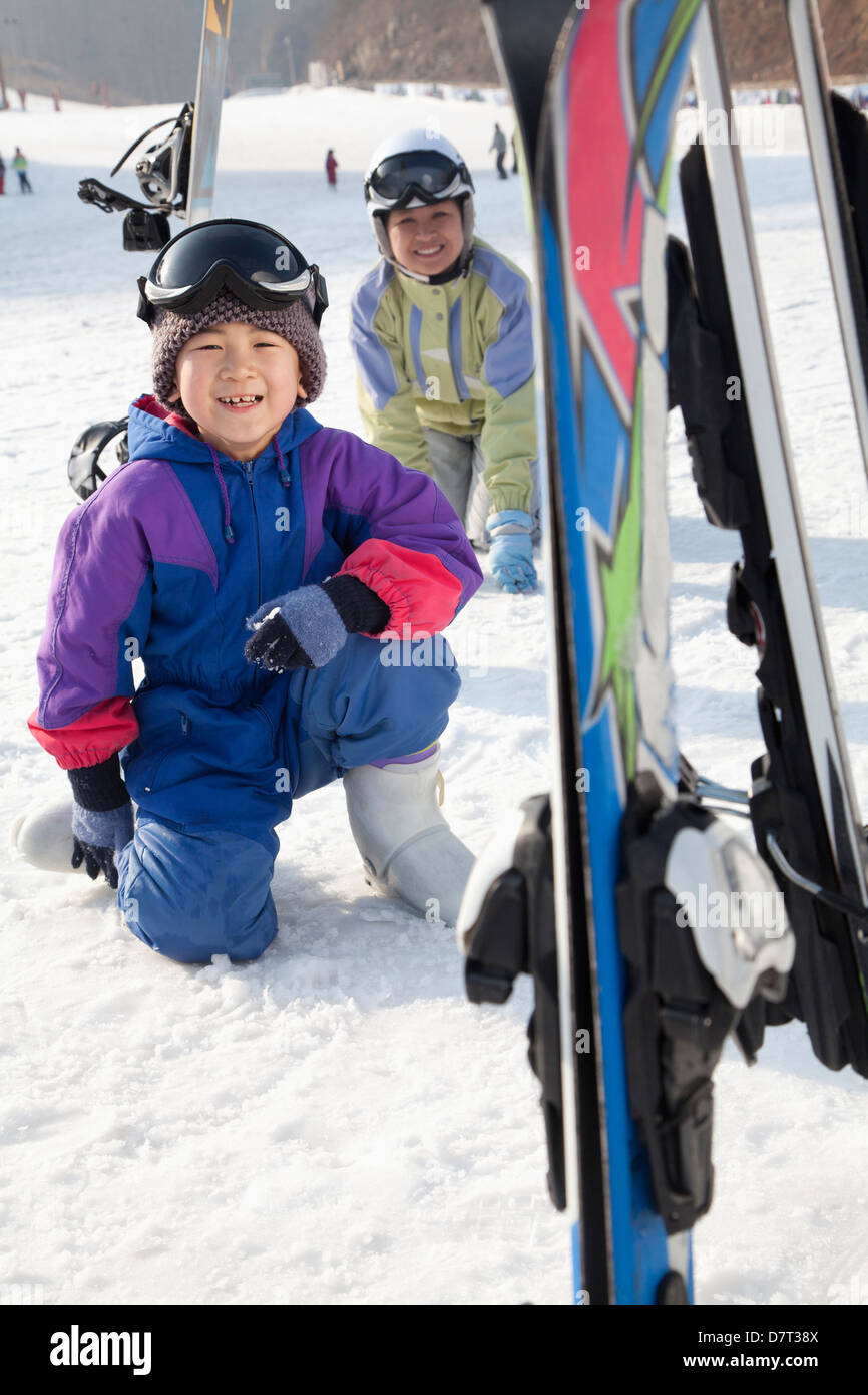 Mother and Son Smiling in Ski Resort Stock Photo