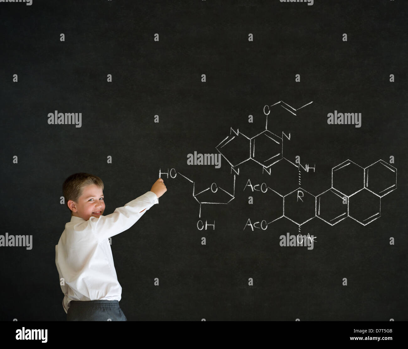 Writing boy dressed up as business man with science or chemistry ...