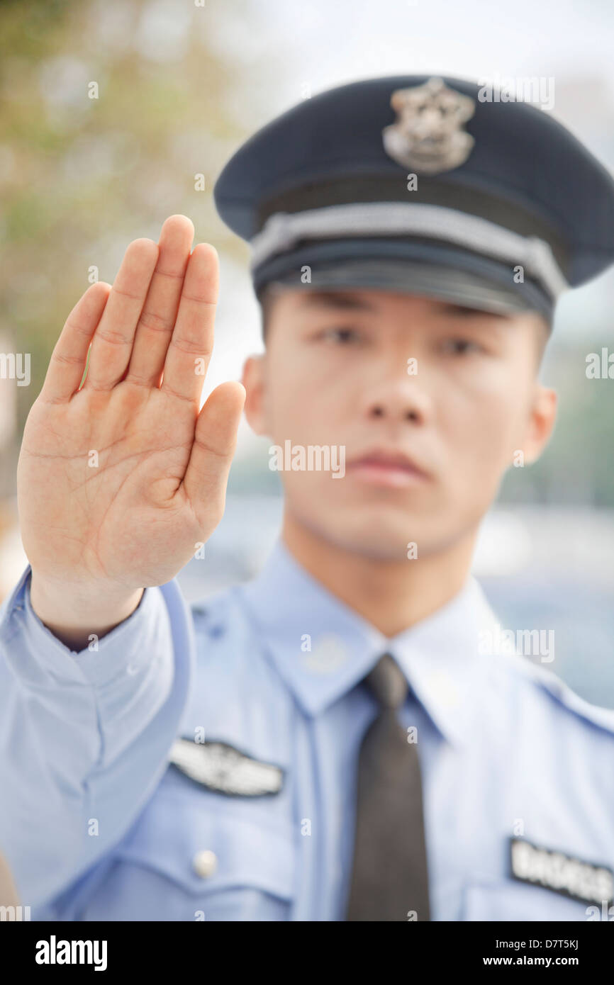 Police Officer Motioning to Stop Stock Photo