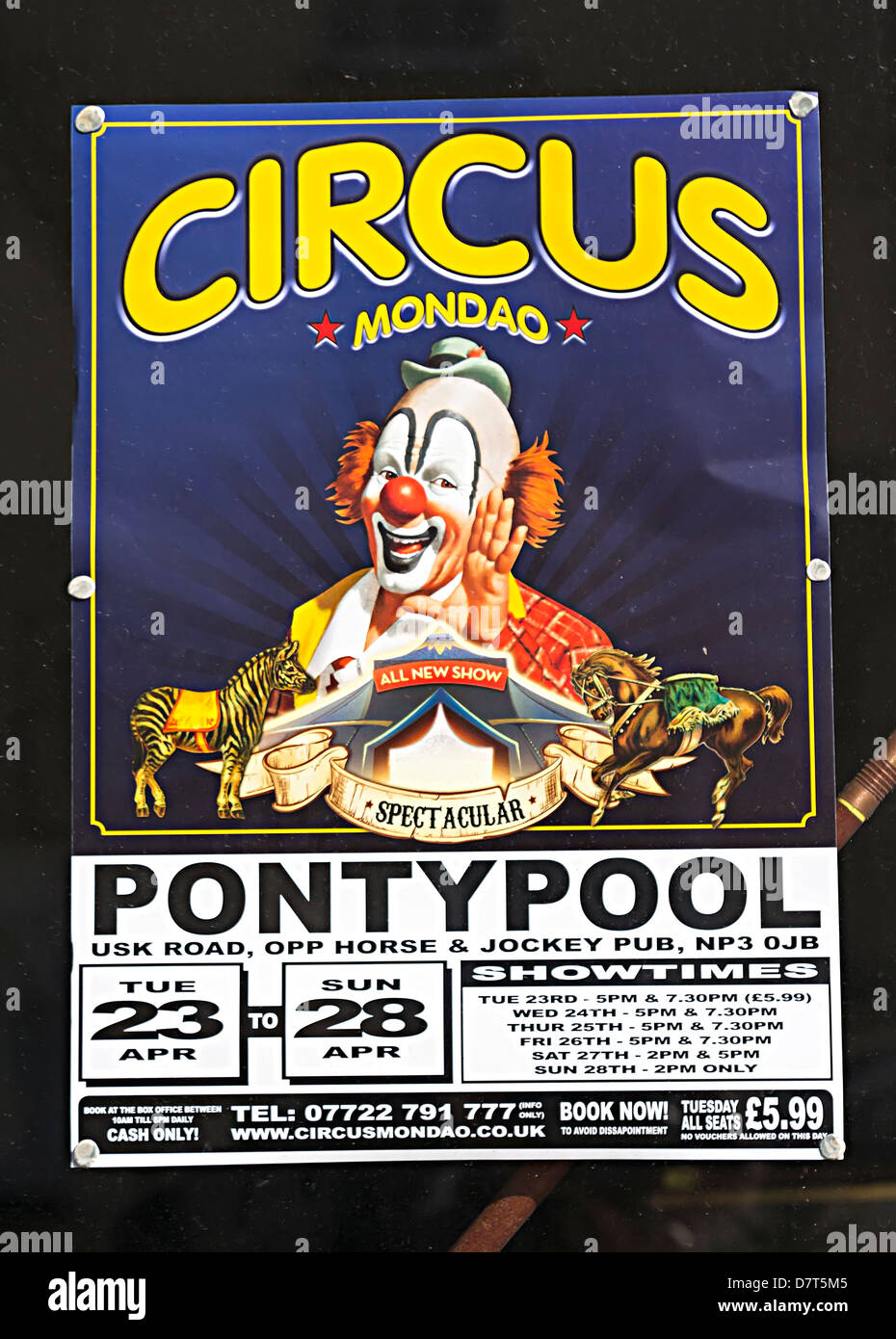 Circus poster in shop window, UK Stock Photo