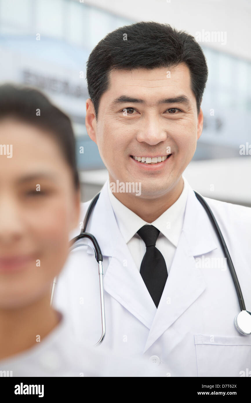 Portrait of Doctor, Nurse in Foreground Stock Photo Alamy