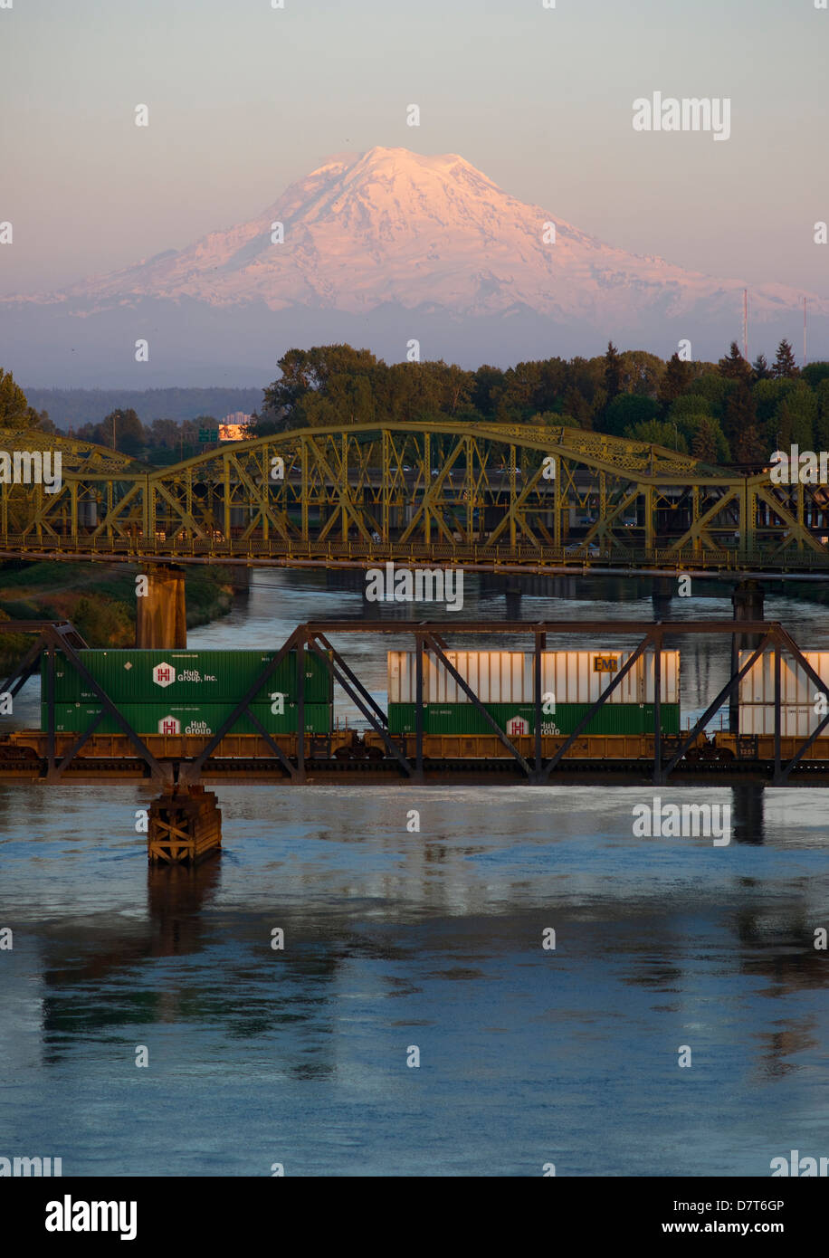 The Puyallup River meanders down from the glaciers on Mount Rainier under bridges through cities on it's way to Puget Sound Stock Photo