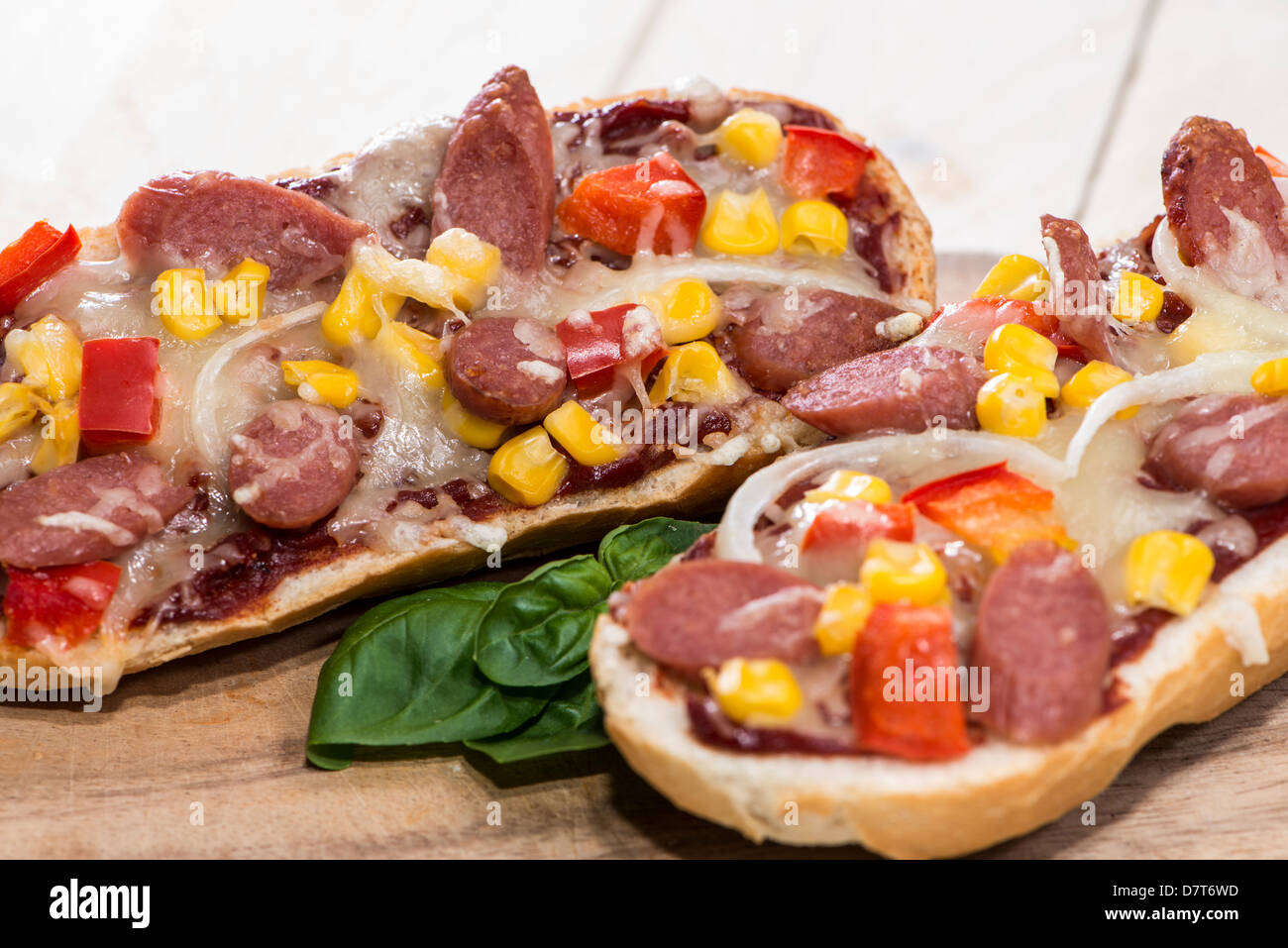 Homemade Salami Pizza Baguette on wooden background Stock Photo Alamy