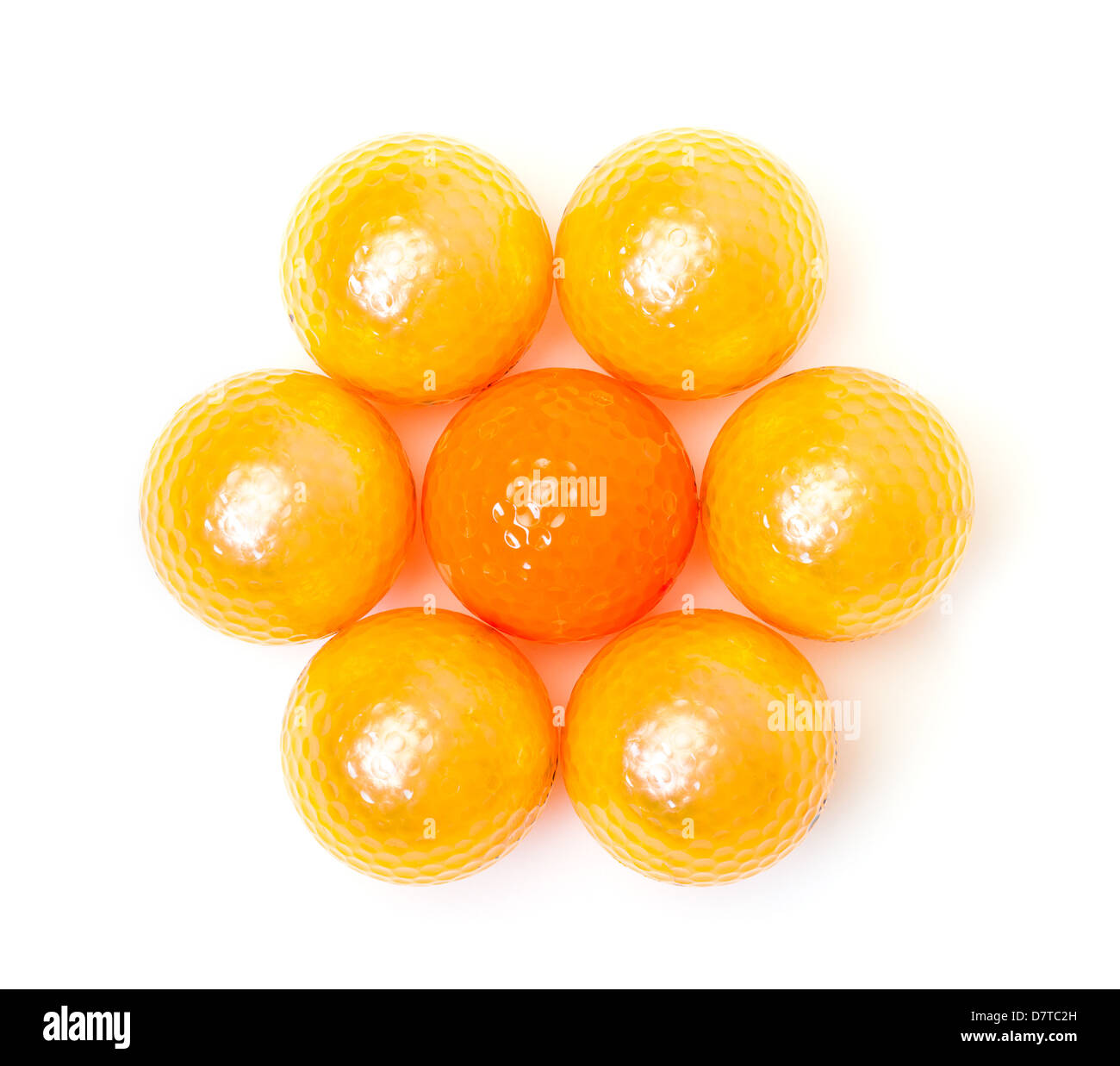 Orange and golden golf balls on white background Stock Photo - Alamy