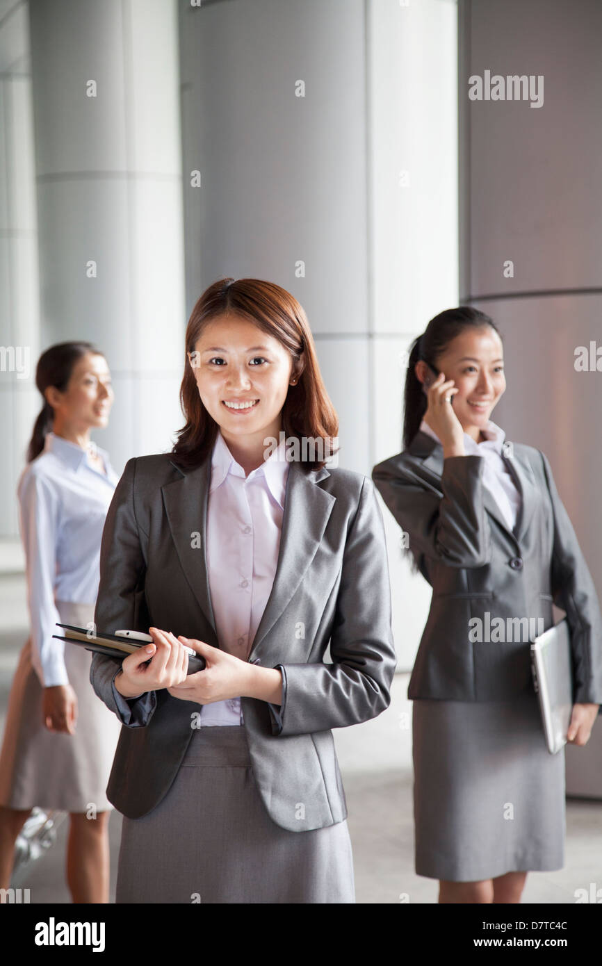 Three young businesswomen outside, portrait Stock Photo - Alamy