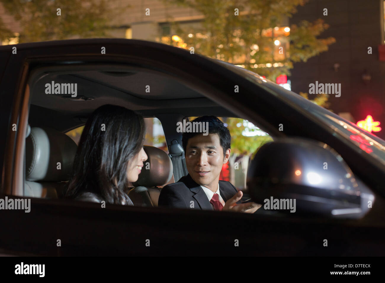 Talking In A Car Chinese business people talking car hi-res stock photography and images ...