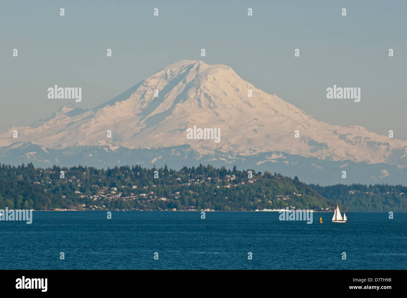 US, WA, Seattle. Volcanic Mt Rainier in Cascades viewed from waters of ...