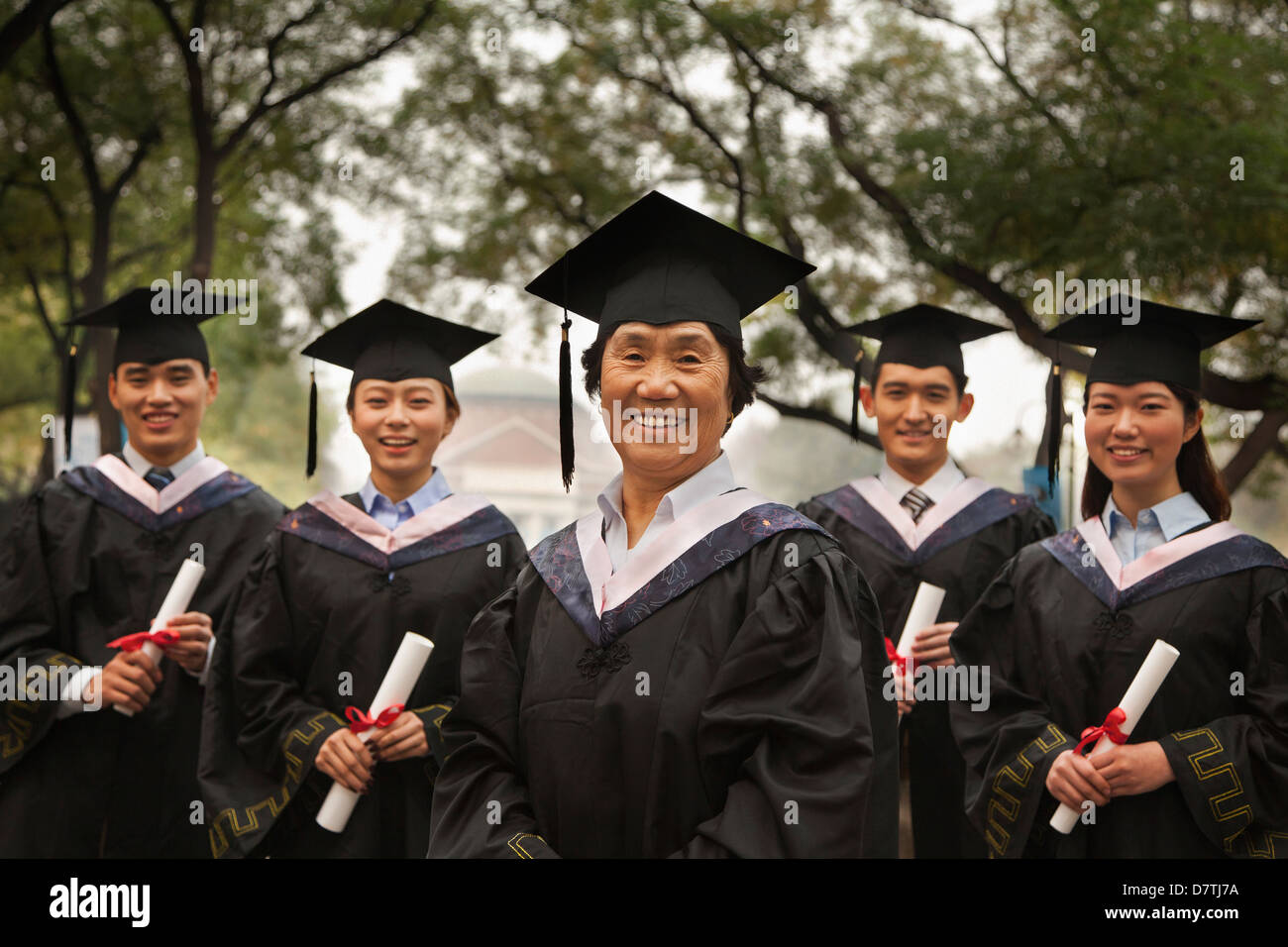 Professor and Graduates Stock Photo - Alamy