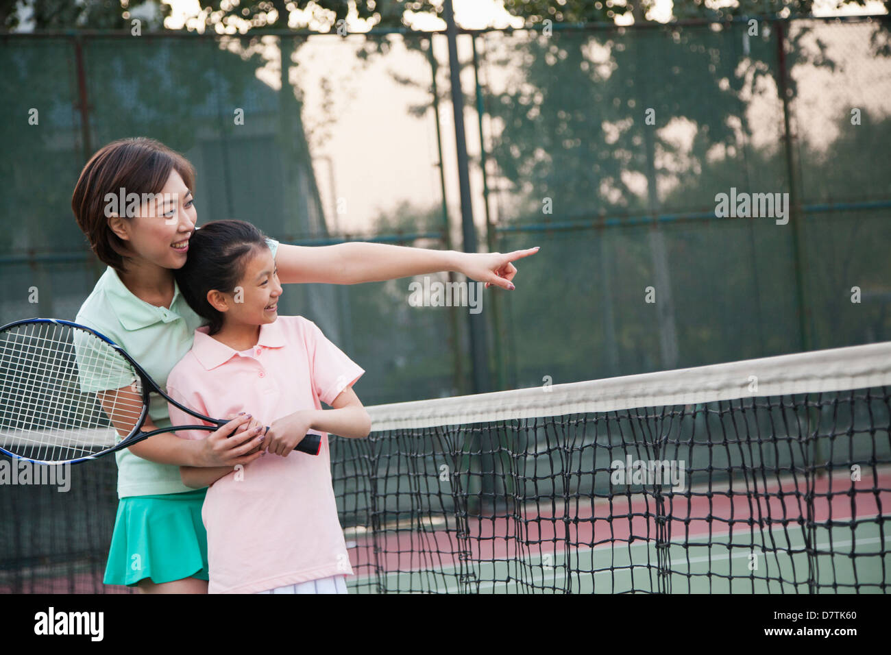 Mother and daughter playing tennis Stock Photo Alamy