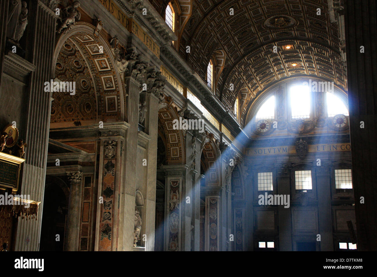 Interior of St. Peter's Cathedral with sun beams, Vatican city, Rome, Italy Stock Photo
