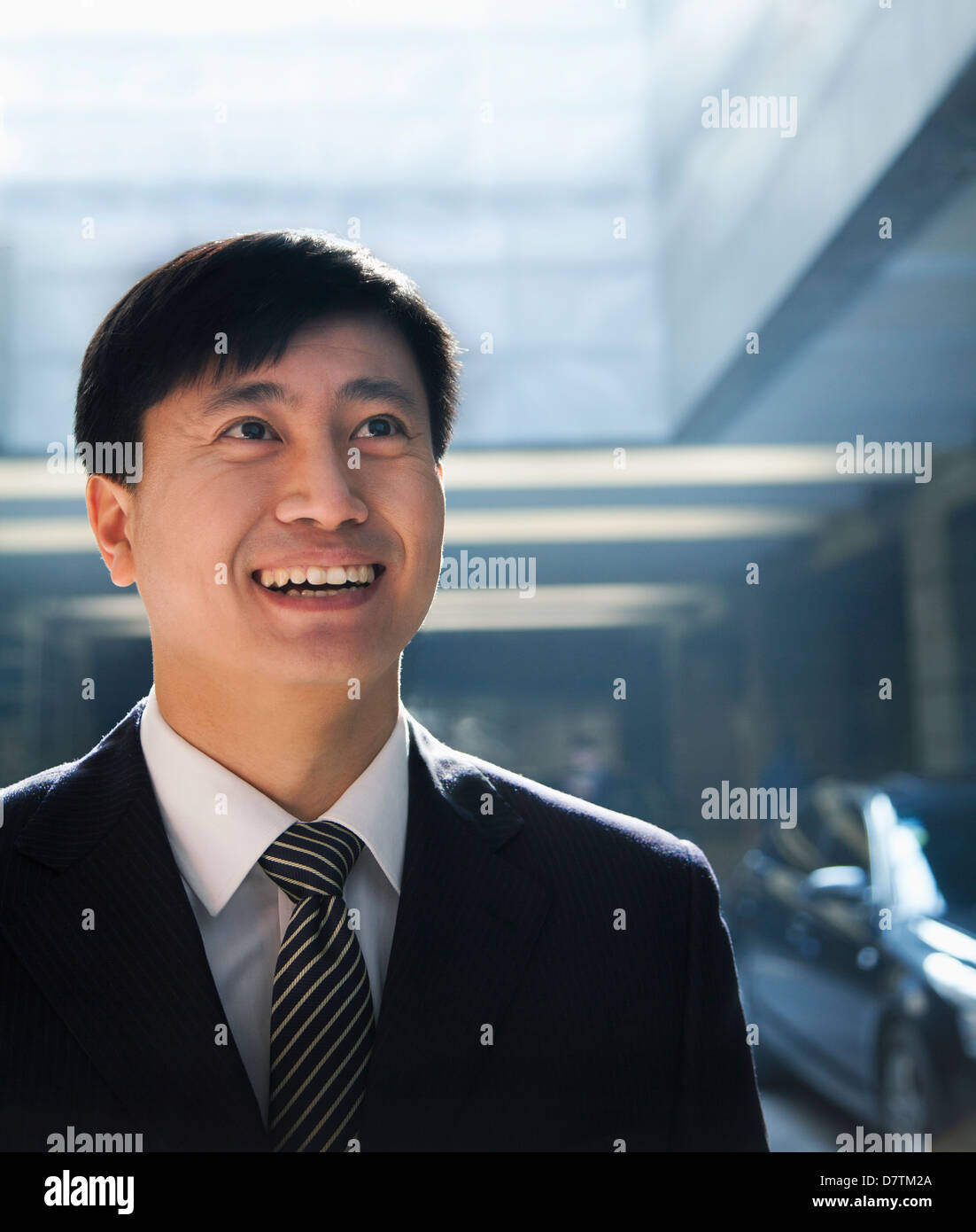 Portrait Of Businessman Looking Up In A Parking Garage Stock Photo Alamy