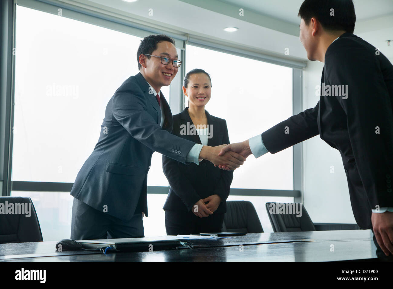Businessmen Greeting Each Other with a Handshake Stock Photo