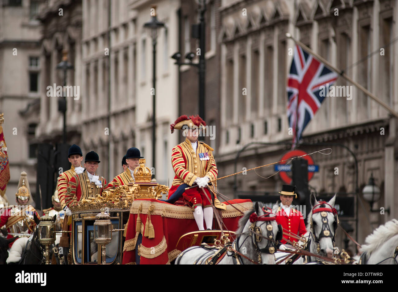 The Queen and Prince Philip travel down Whitehall in The Irish State Coach before the State Opening of Parliament. Stock Photo