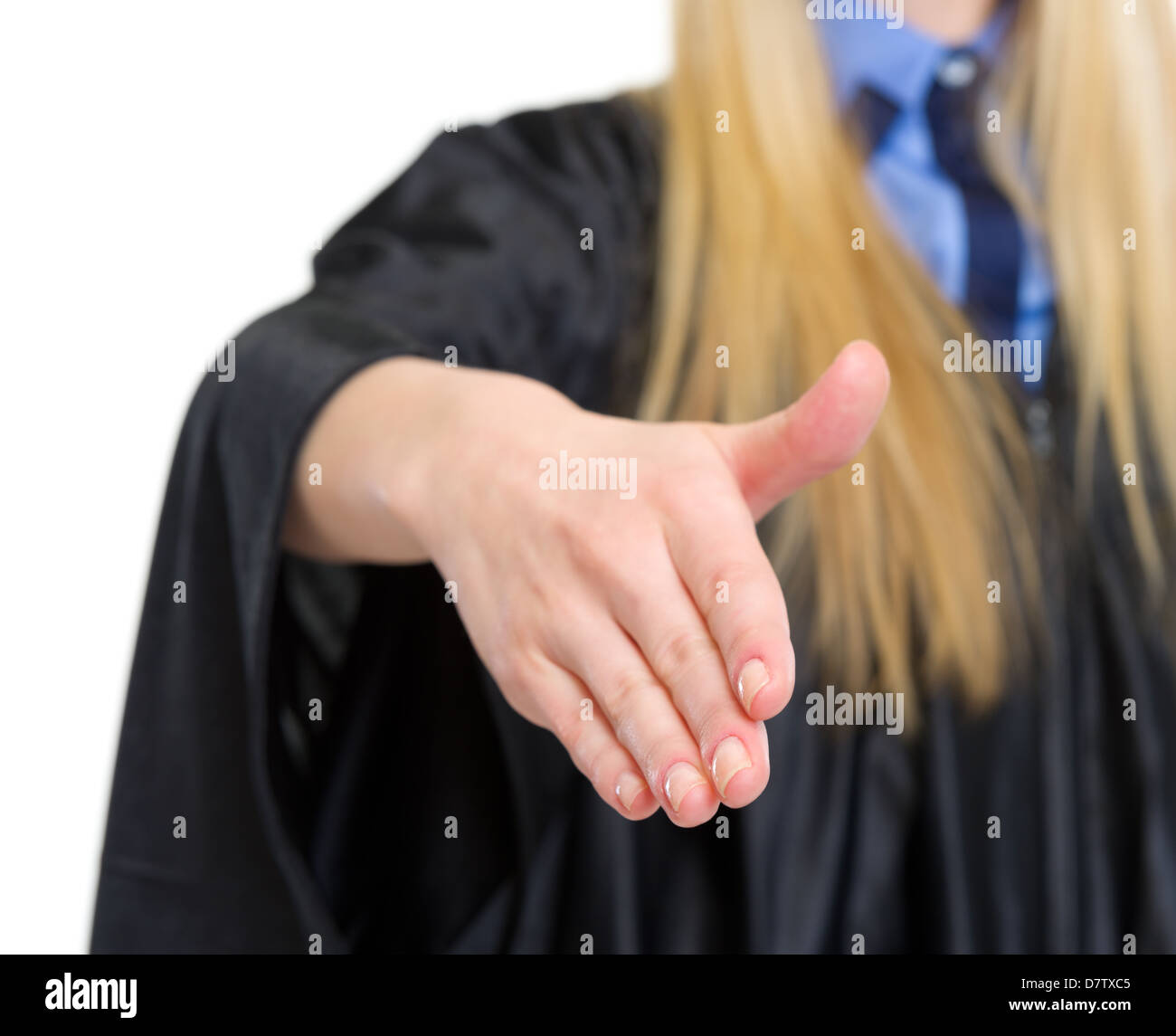 Closeup on woman in graduation gown stretching hand for handshake Stock Photo
