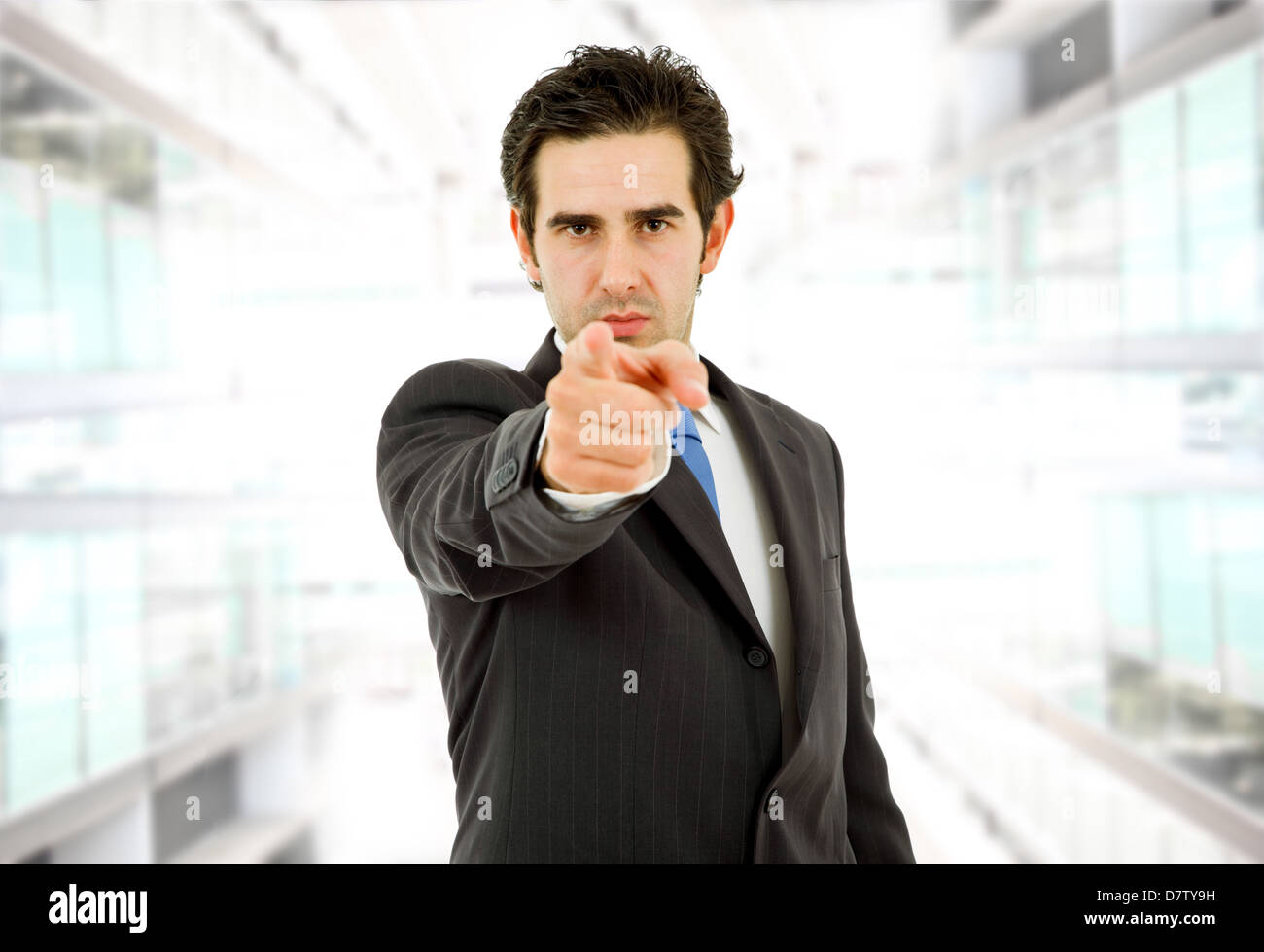 young business man in a suit pointing with his finger Stock Photo - Alamy