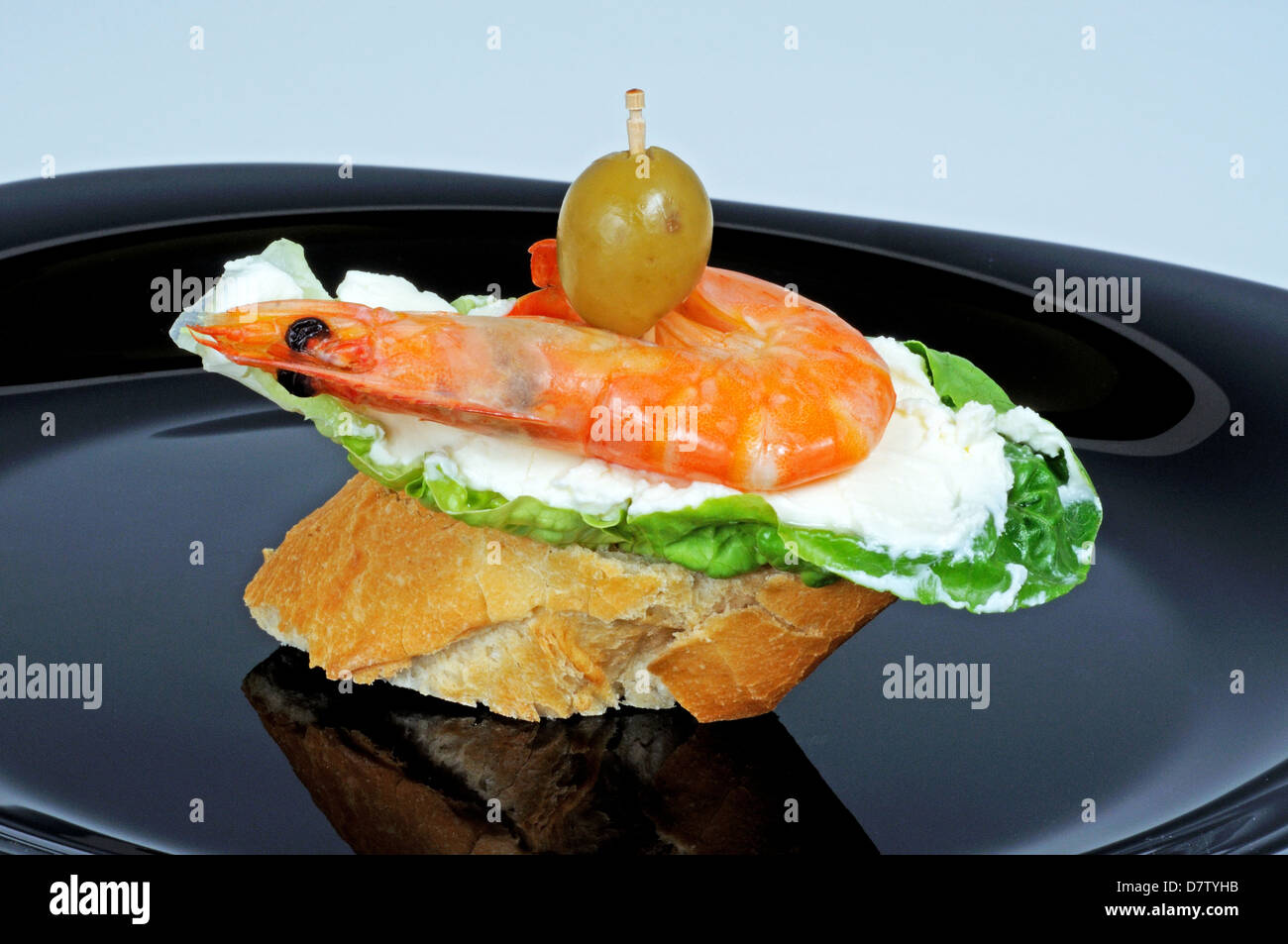 Prawn and cream cheese tapas on bread. Stock Photo