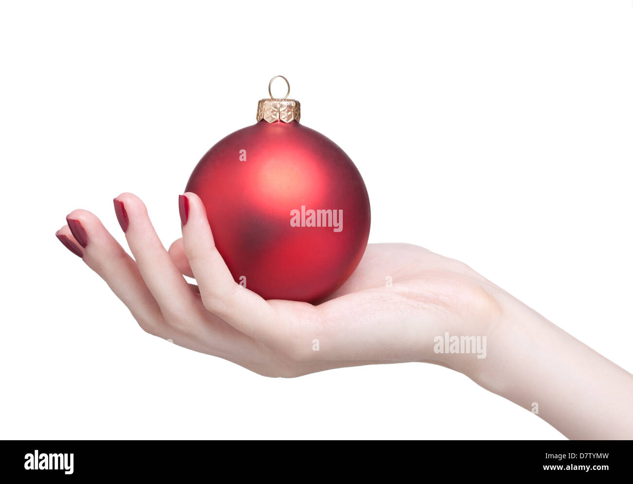 hands with red dull luster Christmas ball isolated on white Stock Photo