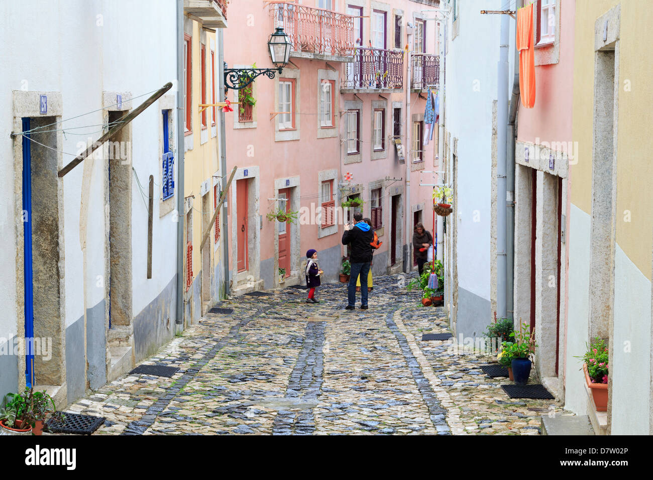 Narrow street in the Castelo District, Lisbon, Portugal Stock Photo