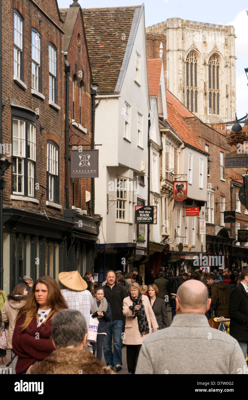 york uk minster tourist busy people street high highstreet streets yorkshire visitor visitors tourists shoppers shopping retail Stock Photo