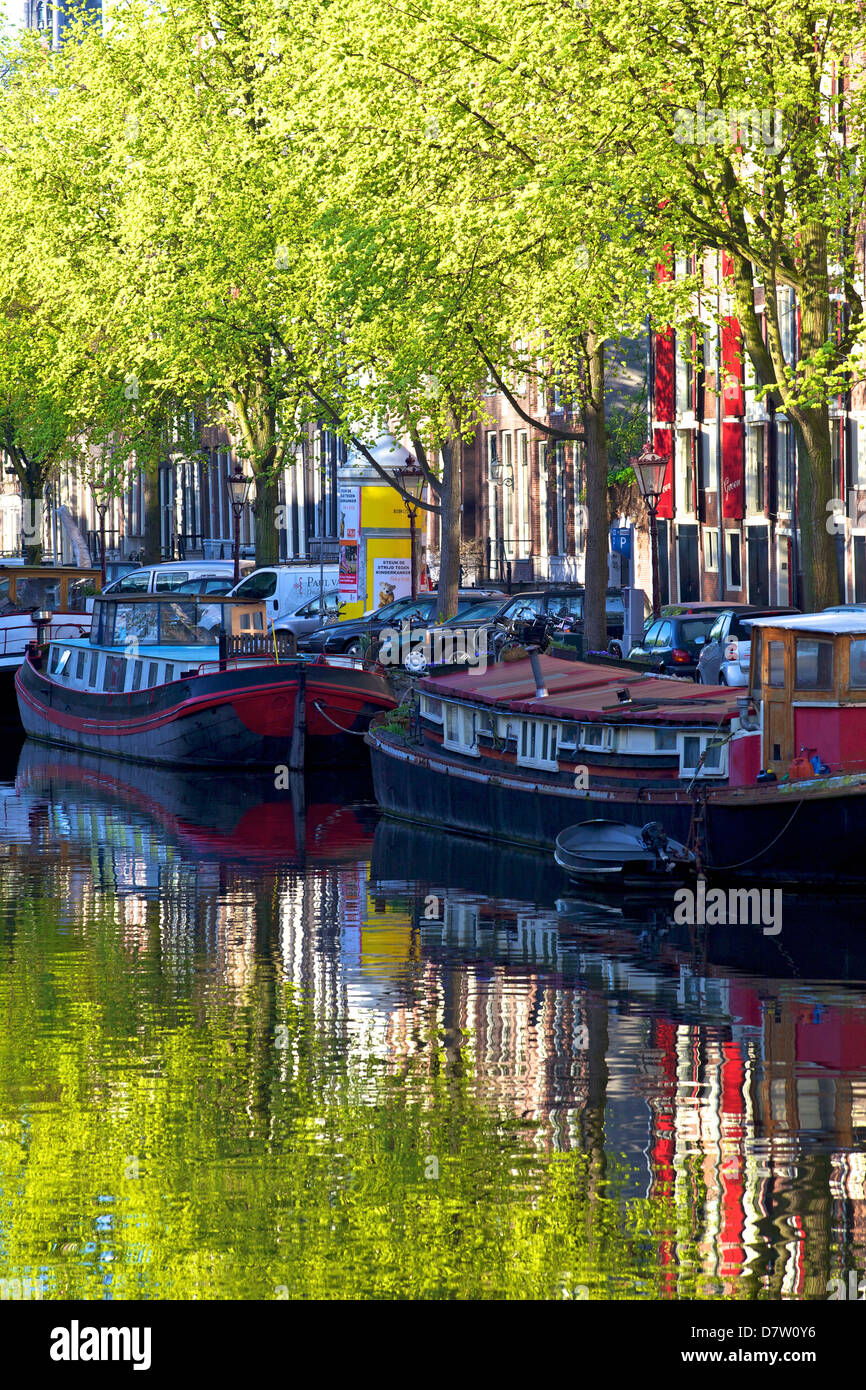 Houseboats on canal, Amsterdam, Netherlands Stock Photo