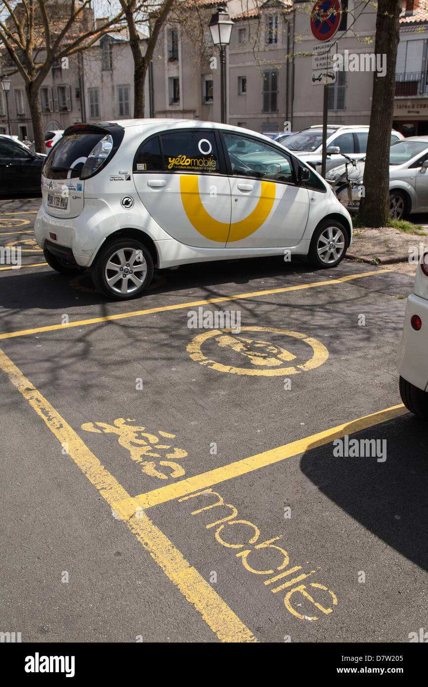 A Yelomobile electric car sharing station in the old city of La Rochelle, France Stock Photo