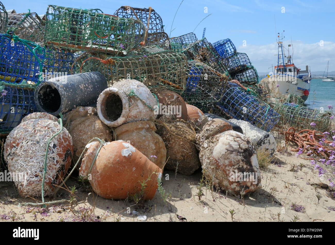 Stack of lobster pots and ceramic octopus pots on Culatra island, Parque Natural da Ria Formosa, near Olhao, Algarve, Portugal Stock Photo