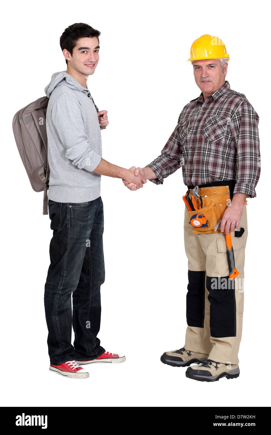 Experienced tradesman meeting new apprentice Stock Photo - Alamy