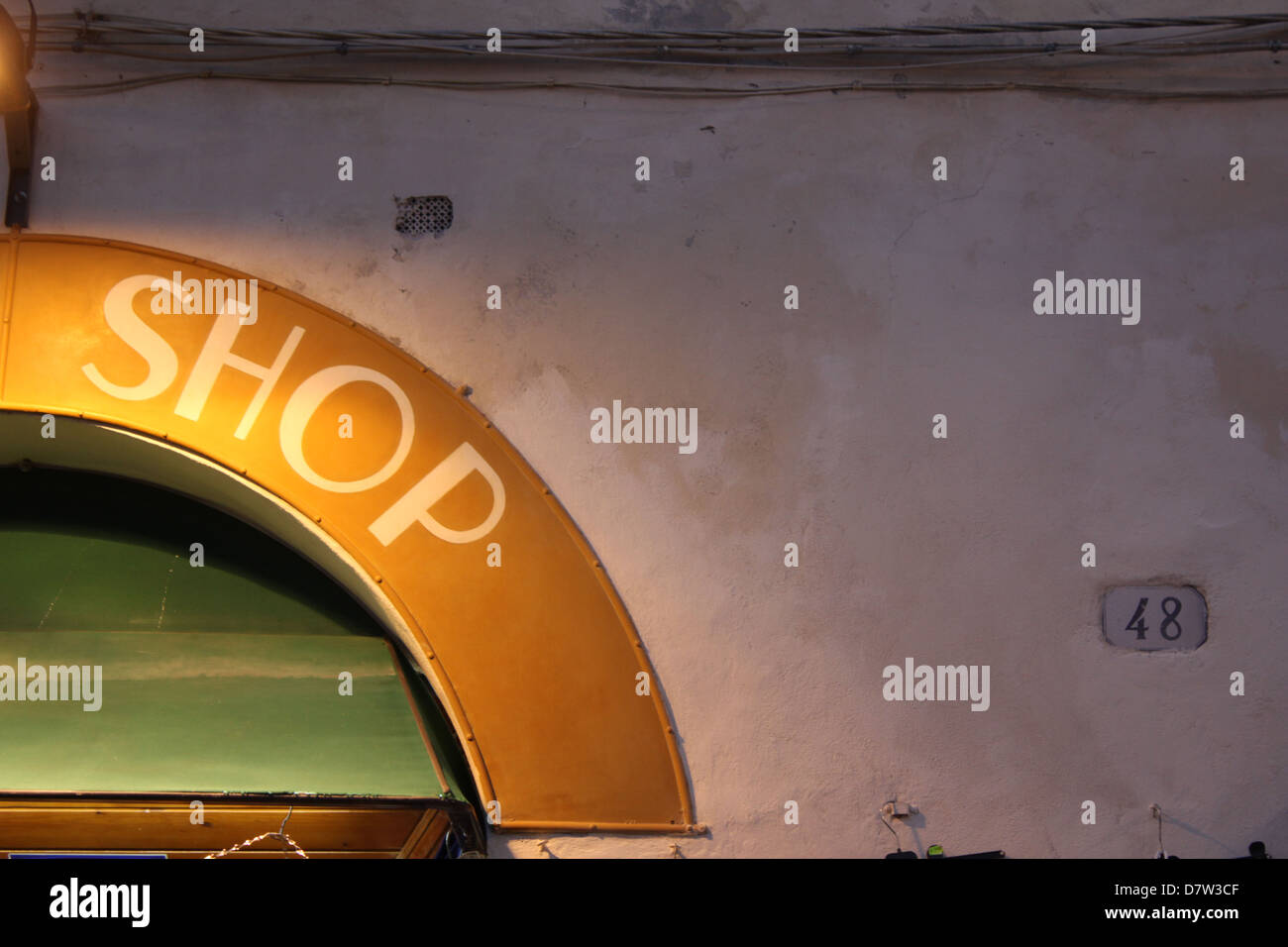 shop sign notice at night in lucca tuscany italy Stock Photo - Alamy
