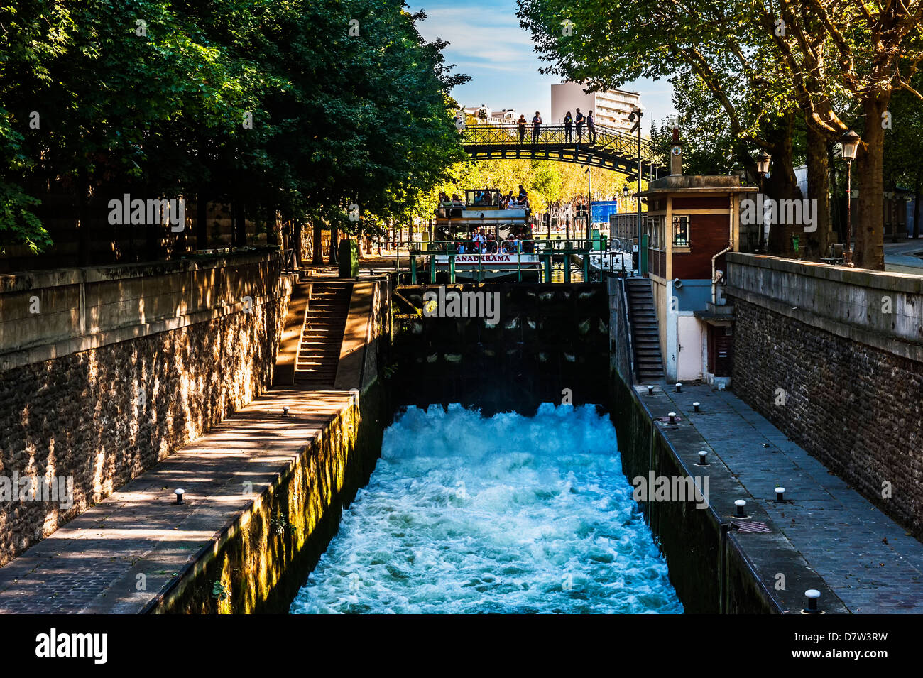 Tourist boat in a canal lock, Canal Saint Martin, Paris, France Stock Photo