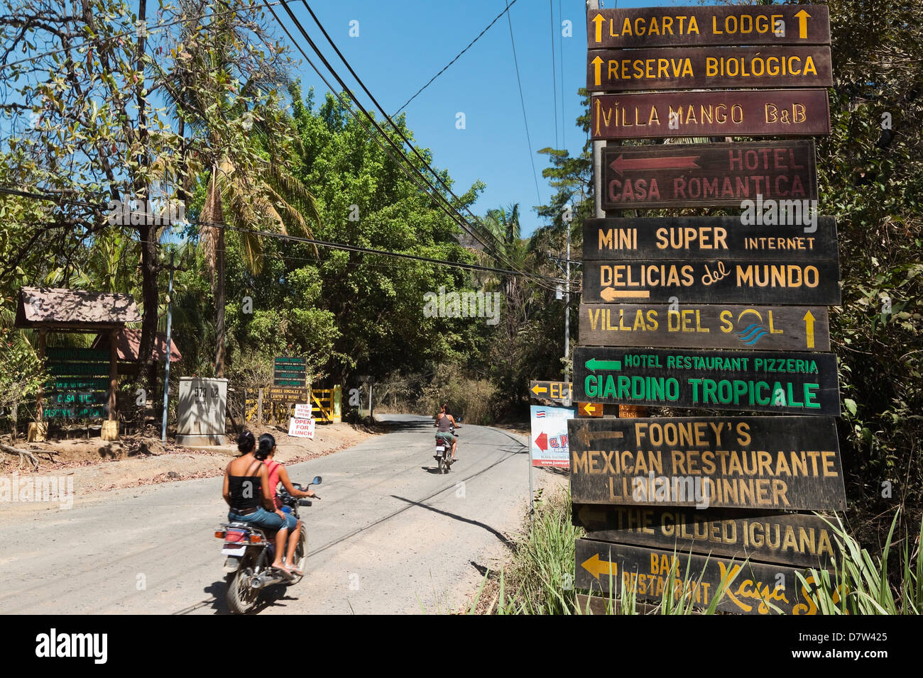 Signs for tourists near popular Playa Guiones beach, Nosara, Nicoya Peninsula, Guanacaste Province, Costa Rica Stock Photo